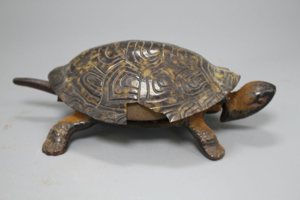 A Victorian cast iron and simulated tortoiseshell table bell, modelled as a tortoise, length 17cm
